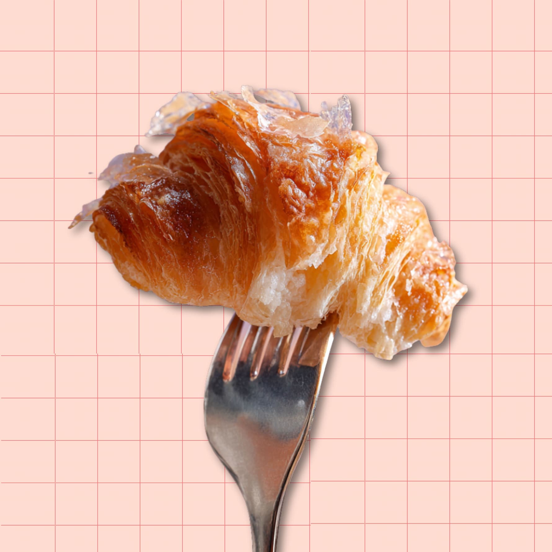 golden flaky croissant piece on a fork against pastel pink grid background