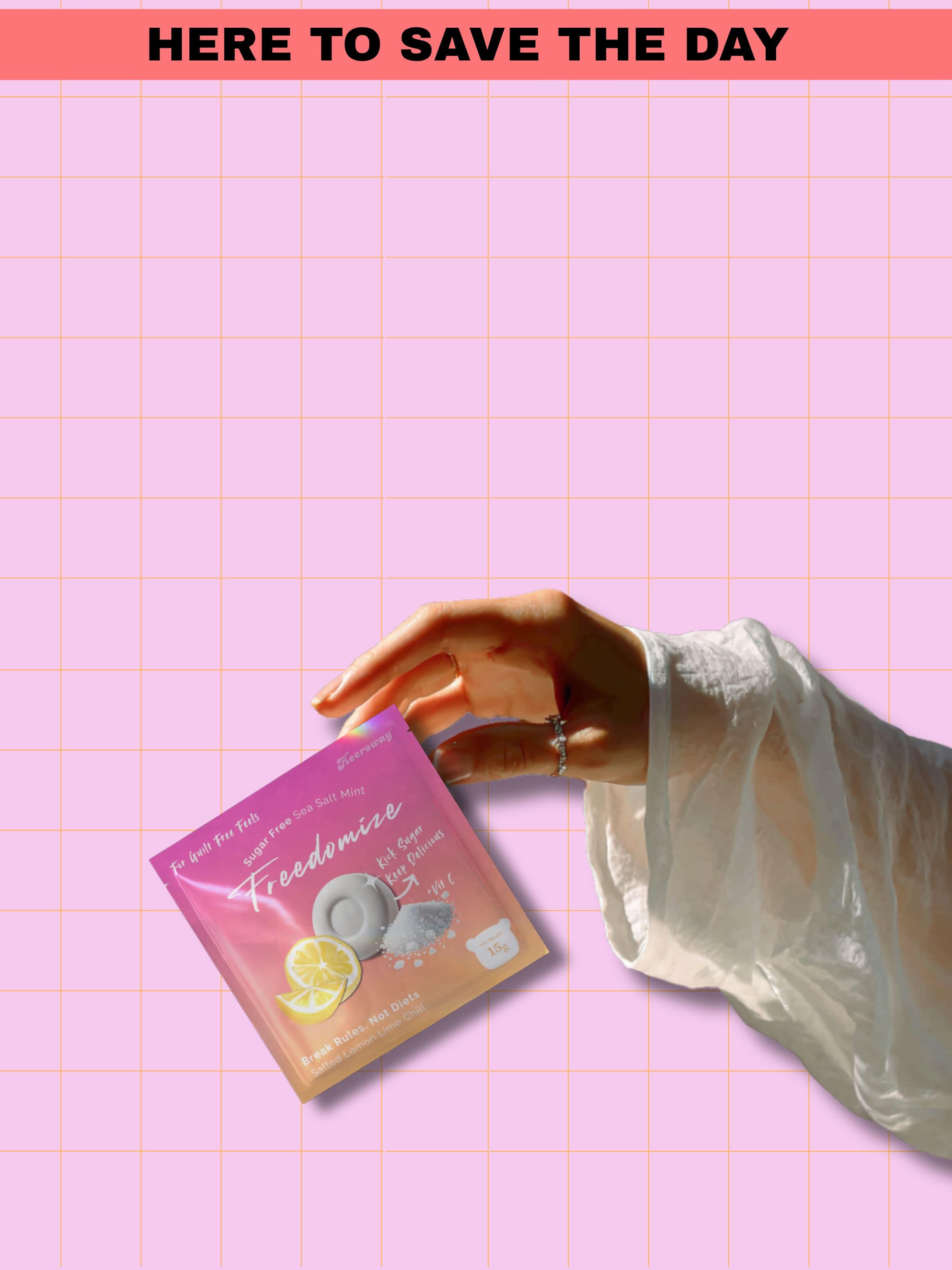 hand holding freedomize sea salt mint sugar free packaging with lemon and mint design on pink grid background and text here to save the day