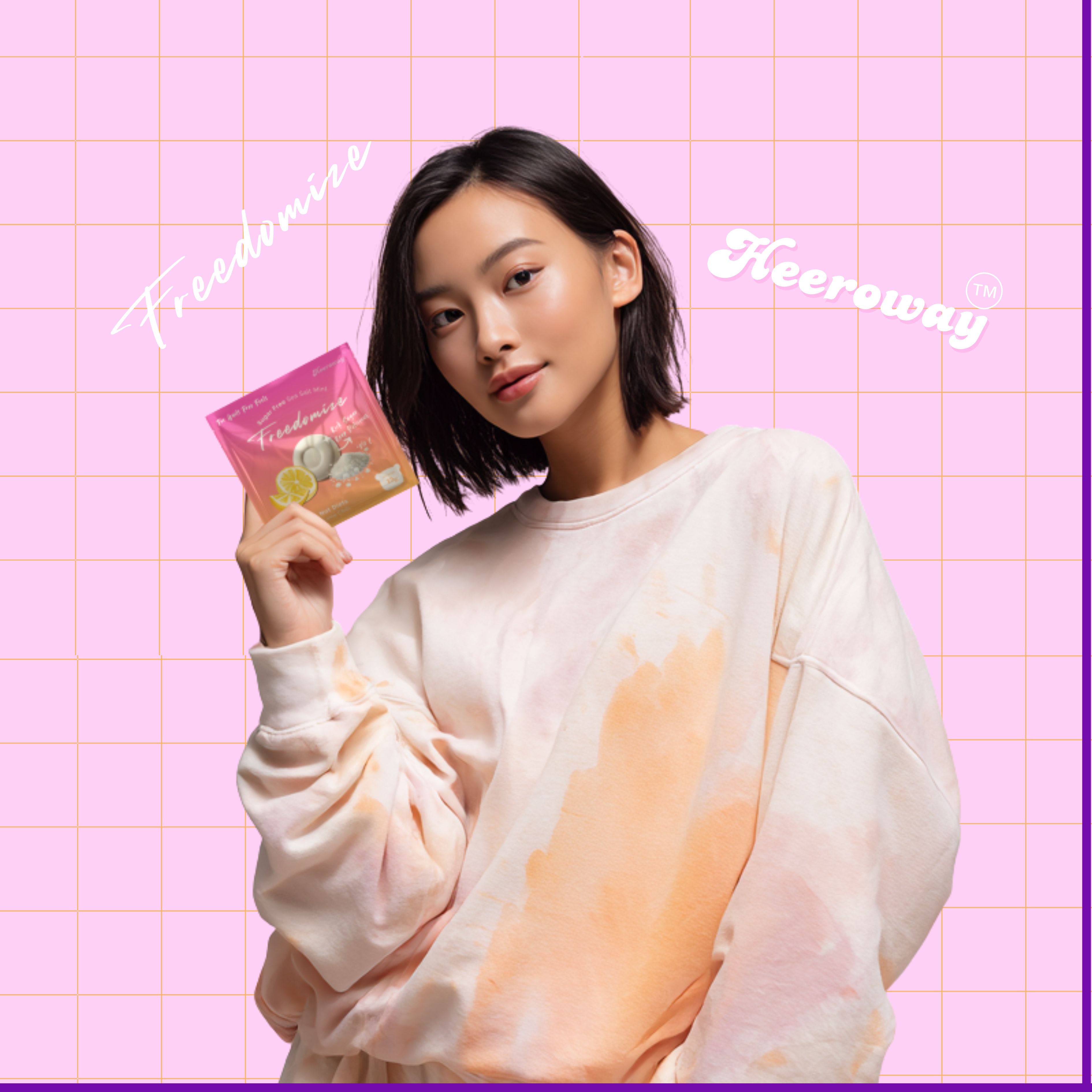 Young woman holding Heeroway Freedomize Sea Salt Mint pouch against a pink grid background. Main banner image for Freedomize product page.
