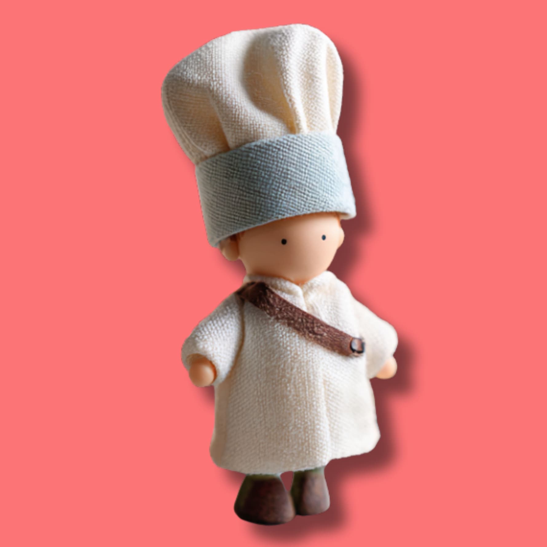 baker’s secret doll figure wearing chef hat and coat symbolizing sugar free baking