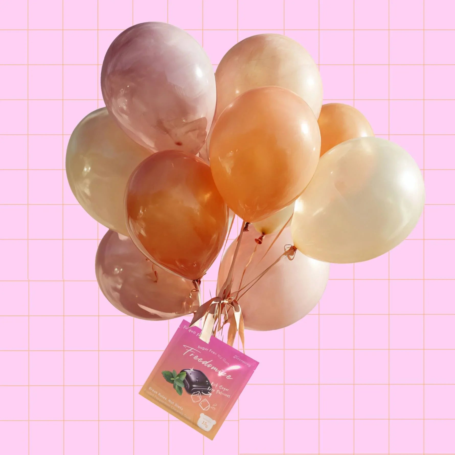 A bunch of pastel balloons tied together with a Freedomize frosted peppermint Sugar Free Icy Gum pouch against a pink grid background.
