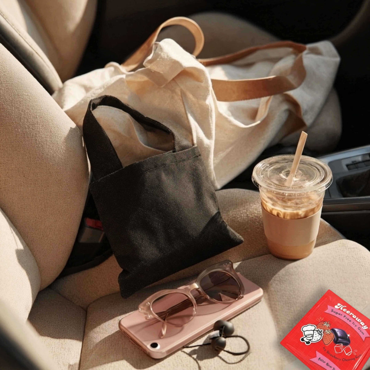 Heeroway frosted peppermint sugar free icy gum packaging on car seat with iced coffee tote bag sunglasses and phone