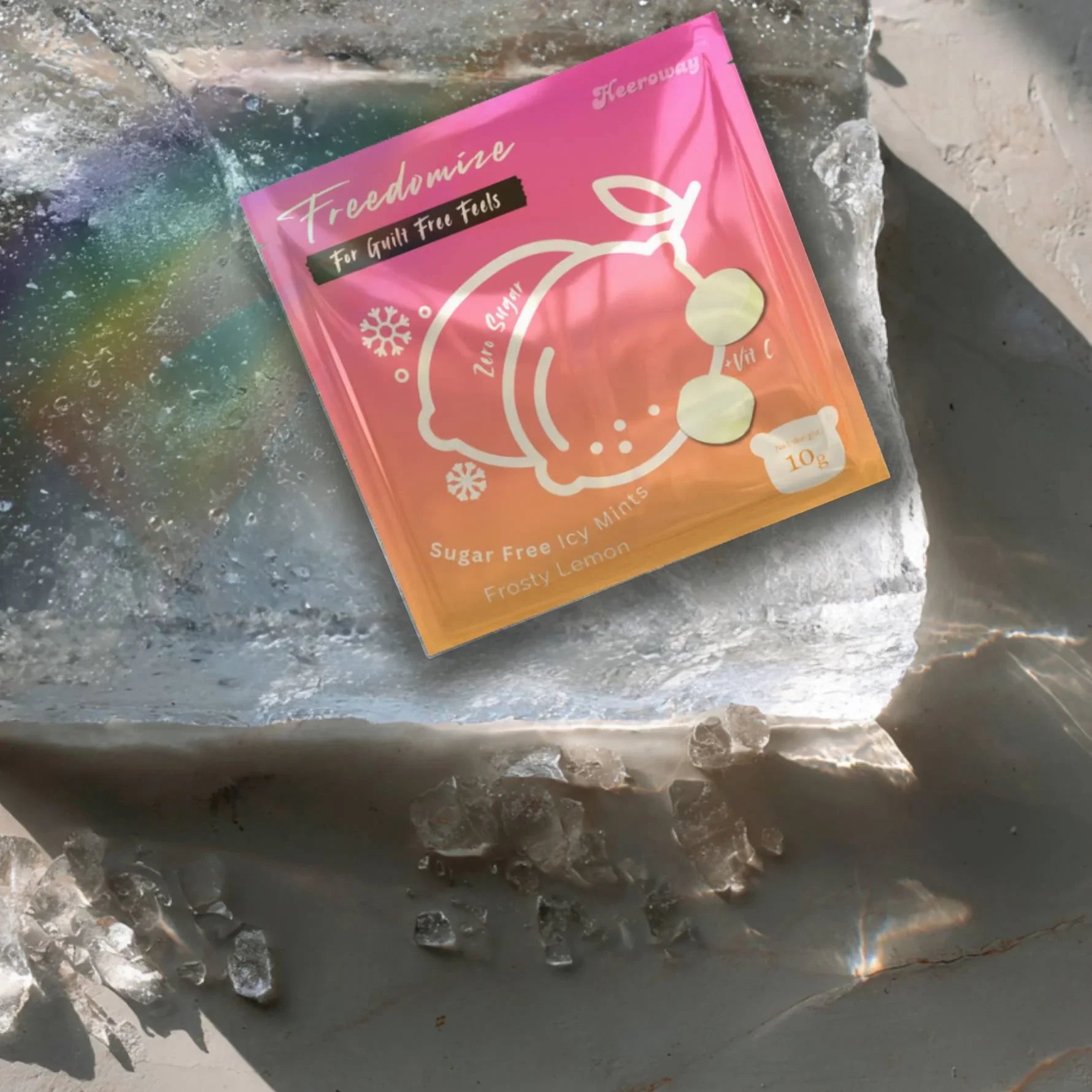 Heeroway Freedomize Frosty Lemon Sugar Free Icy Mints pouch floating against a pink background, showing front and back packaging in product page.