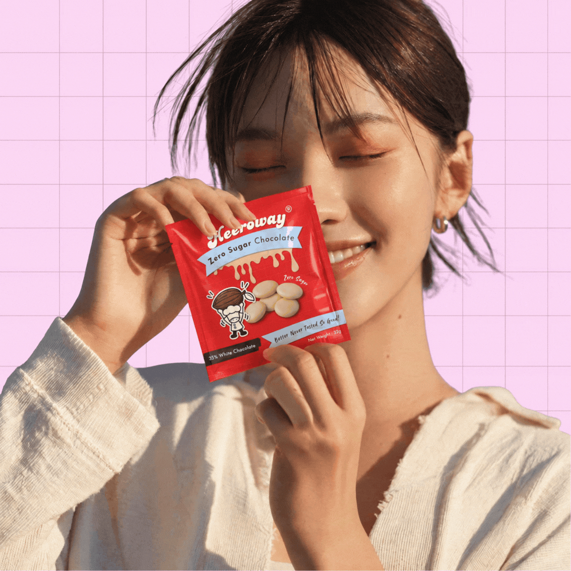 girl holding heeroway snack pouch in gif format
